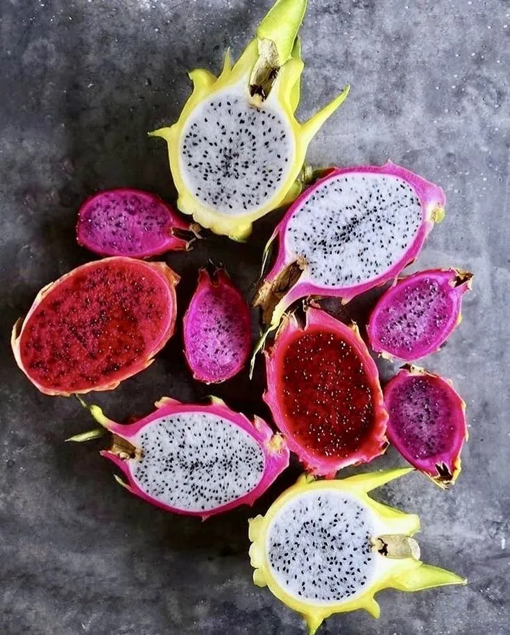 Pitahayas of several colors cut in half