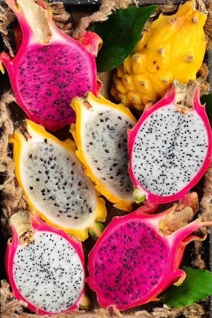 Pitahayas cut in half in a harvest box